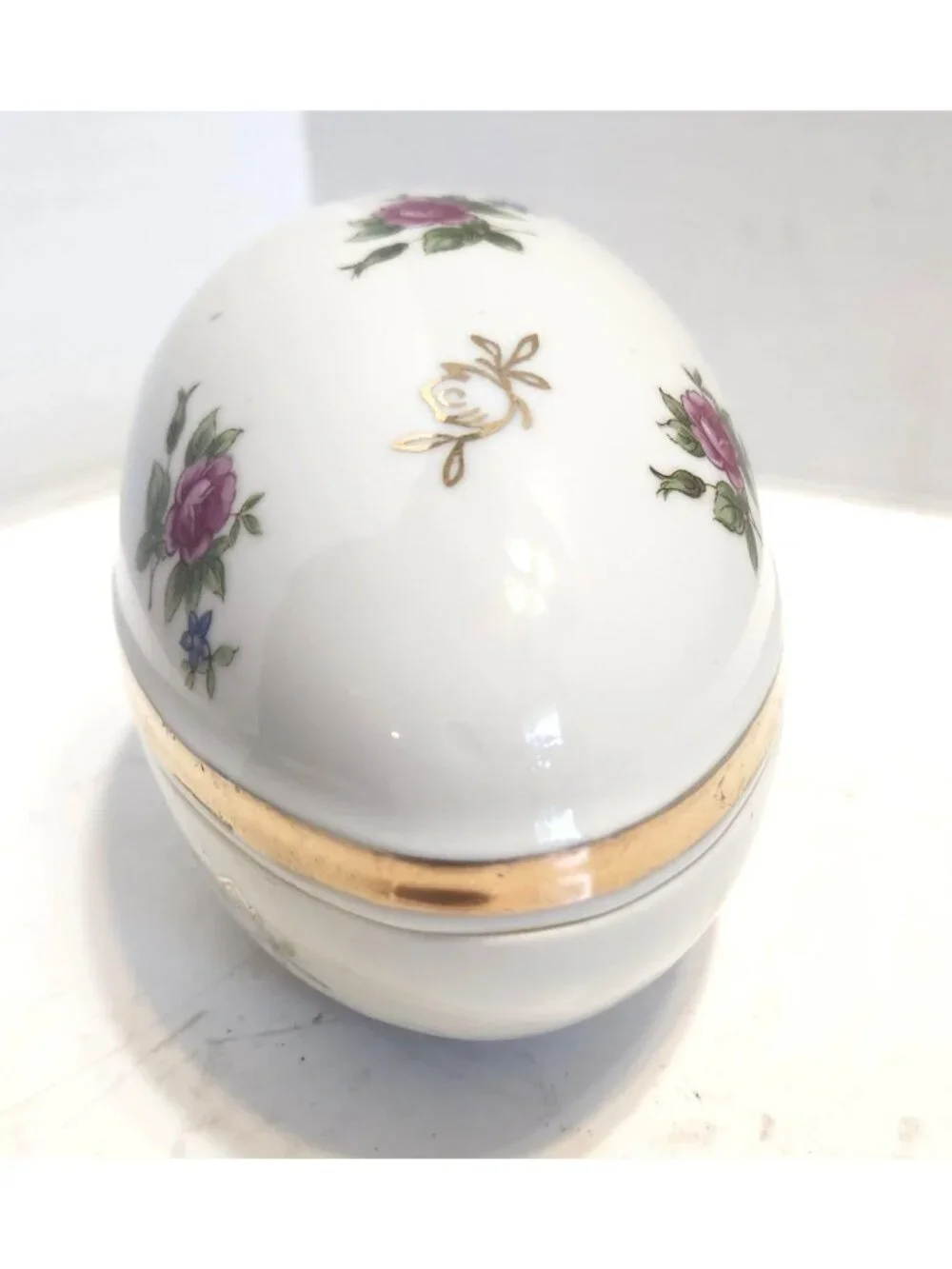 Hand-Painted Porcelain Egg-Shaped Trinket Box With Gold Accents & Floral Design